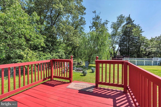 859 Columbia Ave, Newfield, NJ 08344 - wooden terrace with an outdoor fire pit and view of wooded area
