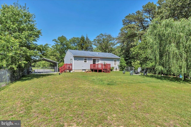 859 Columbia Ave, Newfield, NJ 08344 - view of yard featuring a wooden deck and a detached carport