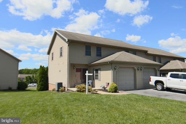 851 Woodridge Dr, Middletown, PA 17057 - view of front of home with an attached garage, a front yard, and driveway