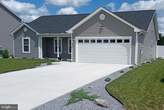 404 Jensen Way E, Martinsburg, WV 25401 - view of front facade featuring an attached garage, concrete driveway, roof with shingles, and a front lawn