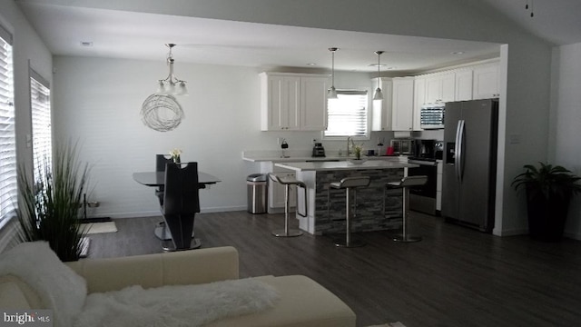 404 Jensen Way E, Martinsburg, WV 25401 - kitchen featuring stainless steel appliances, dark wood-style floors, a breakfast bar, white cabinets, and a kitchen island