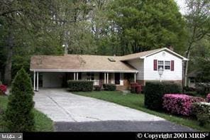 5023 Dodson Dr, Annandale, VA 22003 - view of front of property featuring concrete driveway, a carport, and a front yard