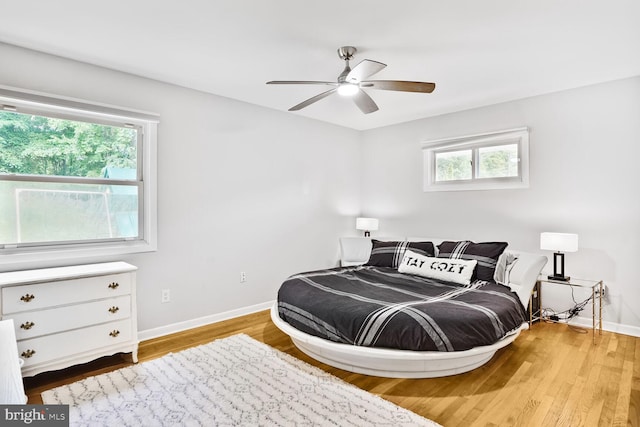 11106 Byrd Dr, Fairfax, VA 22030 - bedroom featuring baseboards, wood finished floors, and a ceiling fan