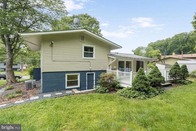 11106 Byrd Dr, Fairfax, VA 22030 - back of house with a yard and central AC