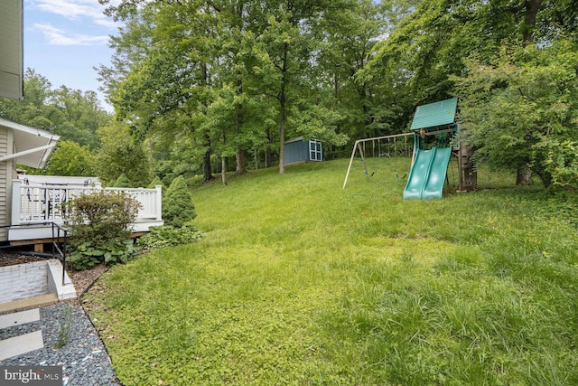 11106 Byrd Dr, Fairfax, VA 22030 - view of green lawn featuring a playground and a wooden deck