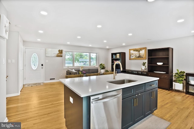 11106 Byrd Dr, Fairfax, VA 22030 - kitchen with stainless steel dishwasher, a sink, light wood-style flooring, light countertops, and recessed lighting
