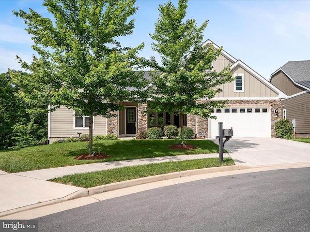 130 Grosbeak Ct, Lake Frederick, VA 22630 - view of front of house with stone siding, board and batten siding, driveway, and a front lawn