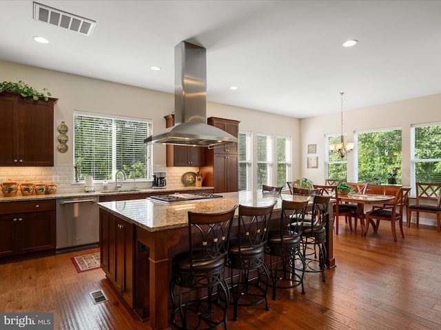 130 Grosbeak Ct, Lake Frederick, VA 22630 - kitchen with island range hood, appliances with stainless steel finishes, a sink, a kitchen island, and tasteful backsplash