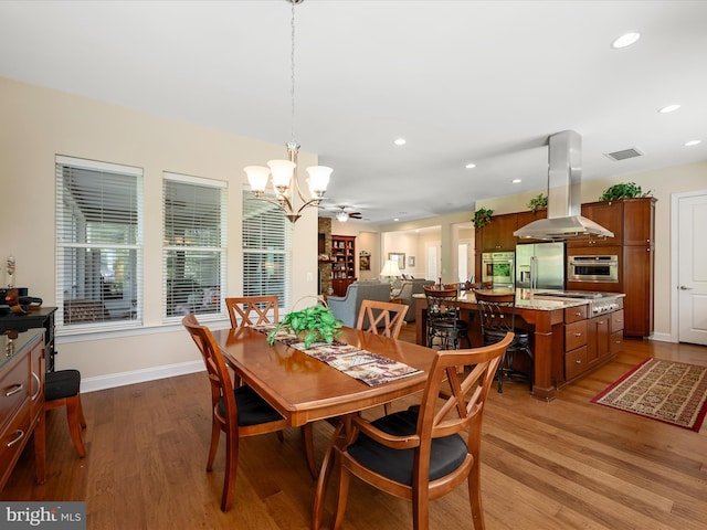 130 Grosbeak Ct, Lake Frederick, VA 22630 - dining area with a chandelier, wood finished floors, recessed lighting, and baseboards