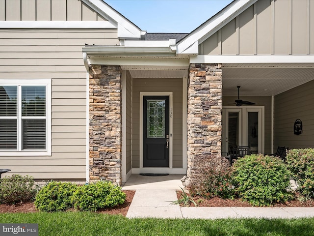 130 Grosbeak Ct, Lake Frederick, VA 22630 - entrance to property featuring stone siding, board and batten siding, ceiling fan, and a porch