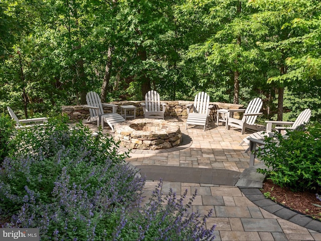 130 Grosbeak Ct, Lake Frederick, VA 22630 - view of patio featuring an outdoor fire pit