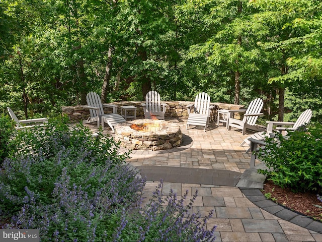 130 Grosbeak Ct, Lake Frederick, VA 22630 - view of patio / terrace featuring a fire pit