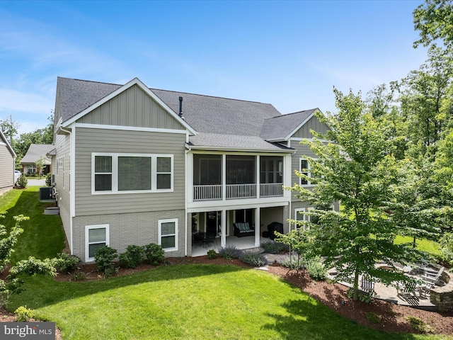 130 Grosbeak Ct, Lake Frederick, VA 22630 - back of house featuring board and batten siding, a patio, a lawn, and roof with shingles
