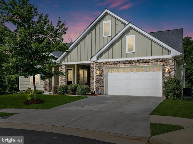 130 Grosbeak Ct, Lake Frederick, VA 22630 - craftsman house with board and batten siding, stone siding, a shingled roof, concrete driveway, and a front yard