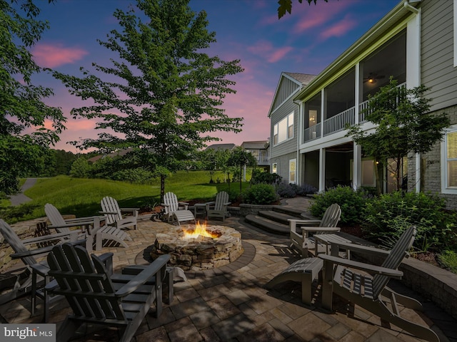 130 Grosbeak Ct, Lake Frederick, VA 22630 - patio terrace at dusk with an outdoor fire pit and a patio area