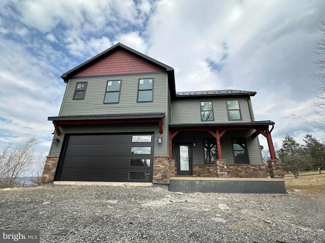 1777 Felmey Rd, Winfield, PA 17889 - view of front of house featuring stone siding, covered porch, gravel driveway, and a garage