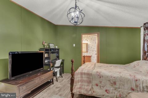 129 Trailway Rd, Middle River, MD 21220 - bedroom with wood finished floors and ensuite bath