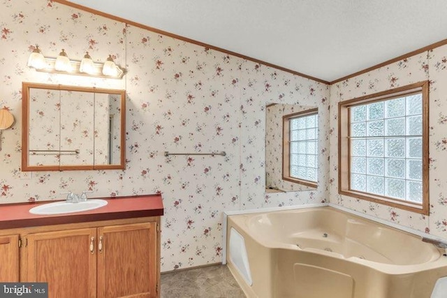 129 Trailway Rd, Middle River, MD 21220 - full bath with ornamental molding, a tub with jets, vanity, wallpapered walls, and lofted ceiling