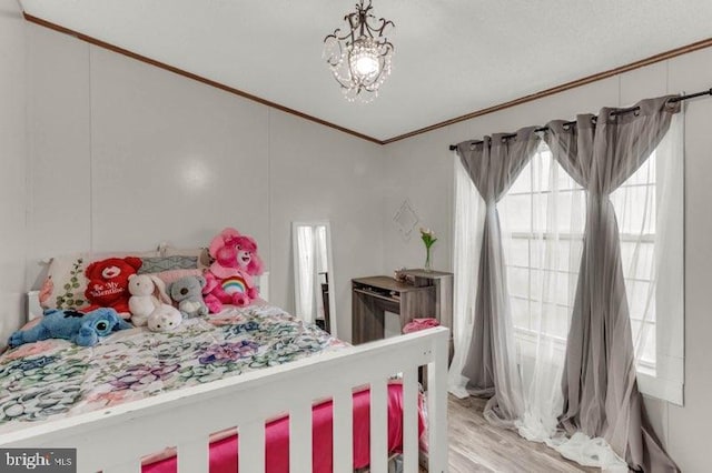 129 Trailway Rd, Middle River, MD 21220 - bedroom featuring ornamental molding, light wood finished floors, and a chandelier