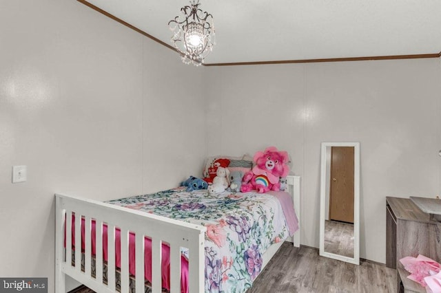 129 Trailway Rd, Middle River, MD 21220 - bedroom with wood finished floors, a chandelier, and ornamental molding