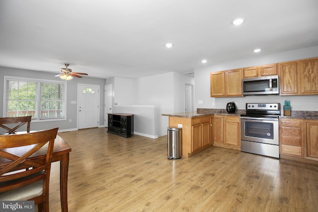 94 Gary Ln, Front Royal, VA 22630 - kitchen with stainless steel appliances, light wood-type flooring, a peninsula, recessed lighting, and ceiling fan