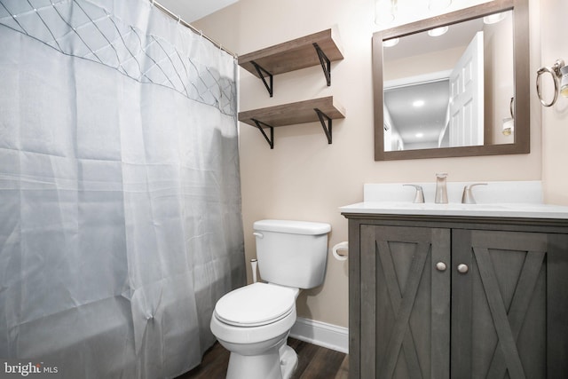 94 Gary Ln, Front Royal, VA 22630 - full bathroom with wood finished floors, vanity, toilet, baseboards, and a shower with curtain