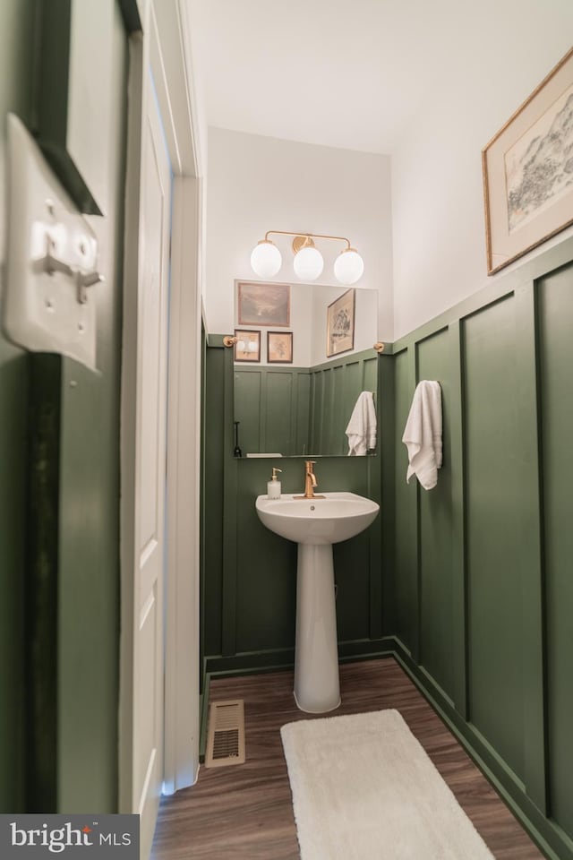 30 Kirby Ct, Bunker Hill, WV 25413 - bathroom with wood finished floors, a decorative wall, and wainscoting