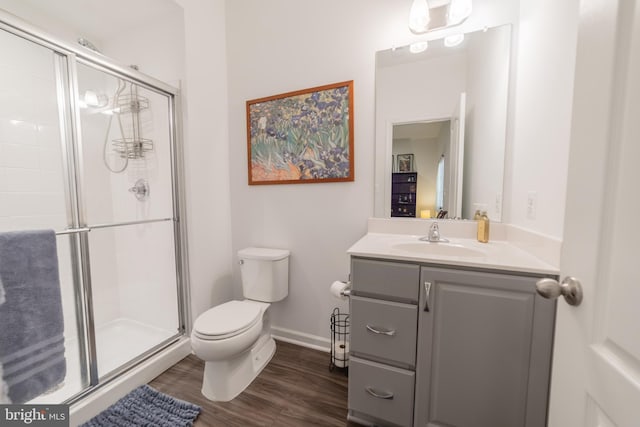 30 Kirby Ct, Bunker Hill, WV 25413 - full bath featuring toilet, a stall shower, vanity, wood finished floors, and baseboards
