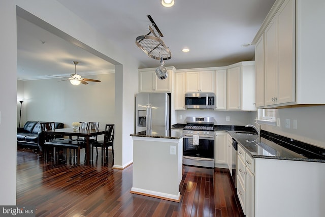 242 Tilden Way Unit 7242, Edgewater, MD 21037 - kitchen featuring stainless steel appliances, a center island, ceiling fan, dark wood finished floors, and dark stone countertops