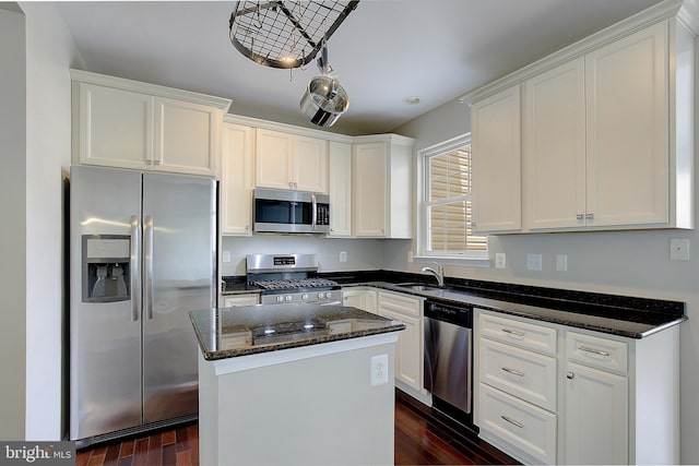 242 Tilden Way Unit 7242, Edgewater, MD 21037 - kitchen with appliances with stainless steel finishes, dark stone counters, white cabinetry, and dark wood-style flooring