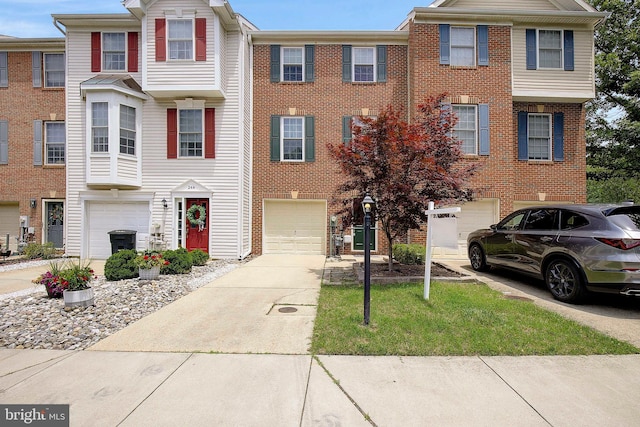 242 Tilden Way Unit 7242, Edgewater, MD 21037 - view of property with an attached garage, driveway, and brick siding