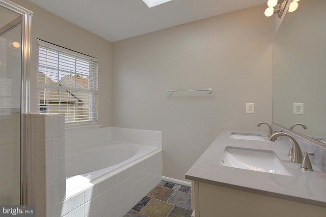 242 Tilden Way Unit 7242, Edgewater, MD 21037 - full bathroom featuring double vanity, a bath, stone finish floors, and a shower stall