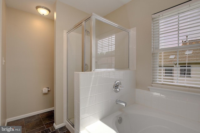 242 Tilden Way Unit 7242, Edgewater, MD 21037 - bathroom featuring a stall shower, a bath, and stone tile floors