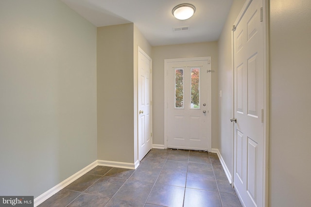 242 Tilden Way Unit 7242, Edgewater, MD 21037 - doorway with baseboards and dark tile patterned flooring
