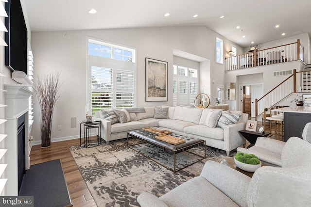 71 Tamarack Cir, Eagleville, PA 19403 - living room featuring stairway, plenty of natural light, wood finished floors, baseboards, and recessed lighting