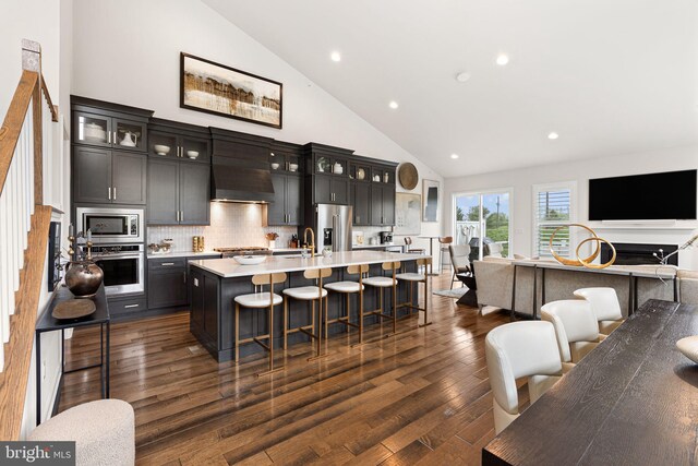 71 Tamarack Cir, Eagleville, PA 19403 - kitchen with appliances with stainless steel finishes, open floor plan, high vaulted ceiling, light countertops, and a sink