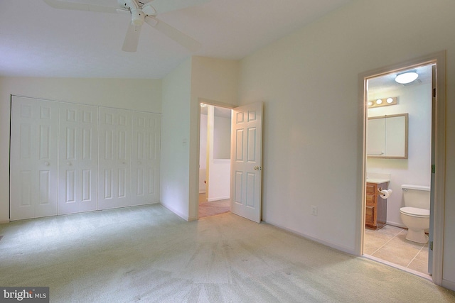2566 Log Mill Ct, Crofton, MD 21114 - unfurnished bedroom featuring light colored carpet, vaulted ceiling, a closet, ensuite bath, and baseboards