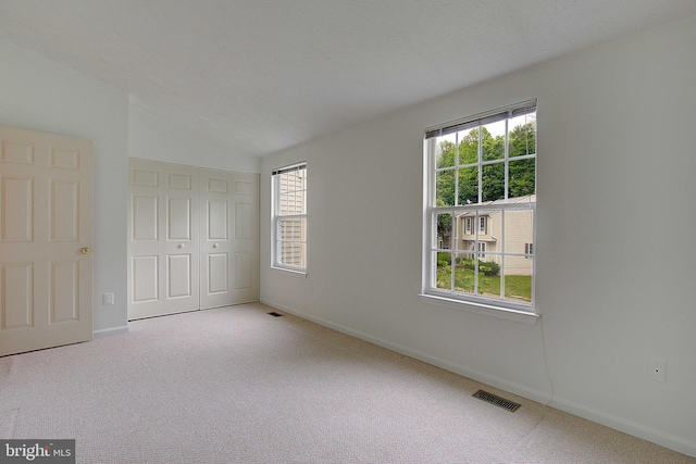 2566 Log Mill Ct, Crofton, MD 21114 - unfurnished bedroom with carpet floors, a closet, baseboards, and vaulted ceiling