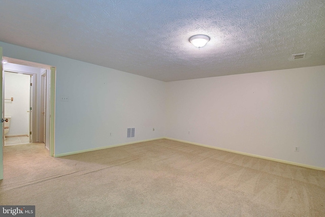 2566 Log Mill Ct, Crofton, MD 21114 - unfurnished room with light carpet, a textured ceiling, and baseboards