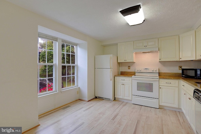 2566 Log Mill Ct, Crofton, MD 21114 - kitchen with white appliances, under cabinet range hood, light wood-style floors, tasteful backsplash, and baseboards