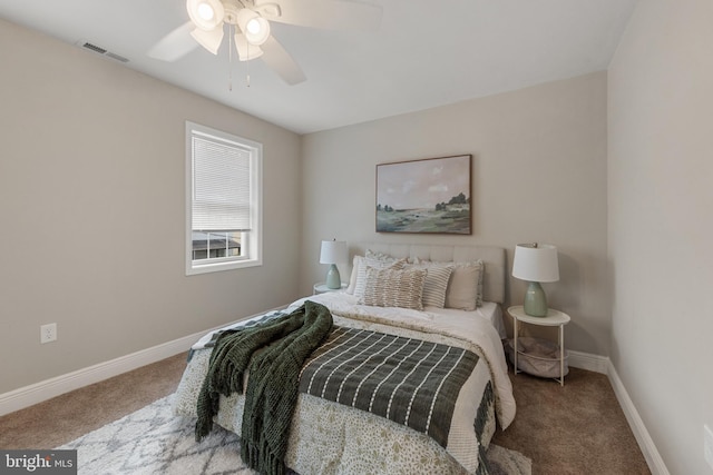 1508 W 36th St W, Baltimore, MD 21211 - carpeted bedroom with baseboards and a ceiling fan