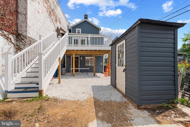 1508 W 36th St W, Baltimore, MD 21211 - back of property featuring a wooden deck, stairway, and a storage shed