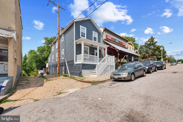 1508 W 36th St W, Baltimore, MD 21211 - view of property featuring covered porch and stairs