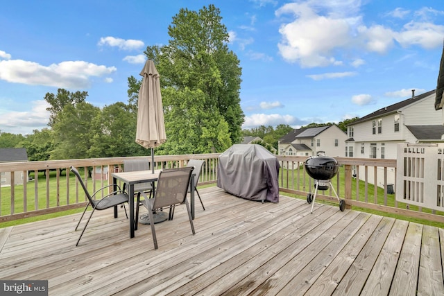 12116 Elmwood Dr, Brandywine, MD 20613 - wooden deck with outdoor dining area, grilling area, a yard, and a residential view