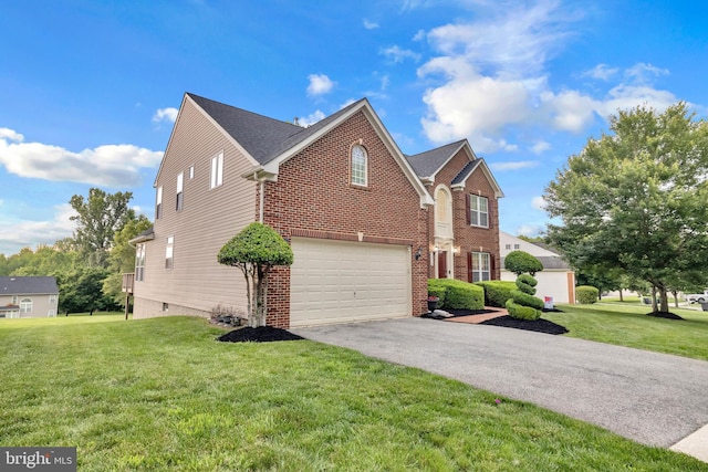 12116 Elmwood Dr, Brandywine, MD 20613 - view of front of home with a garage, brick siding, driveway, and a front lawn