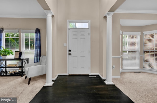 12116 Elmwood Dr, Brandywine, MD 20613 - entrance foyer with ornate columns, ornamental molding, baseboards, and dark wood-style flooring