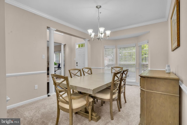 12116 Elmwood Dr, Brandywine, MD 20613 - dining room featuring light colored carpet, ornamental molding, a chandelier, baseboards, and decorative columns