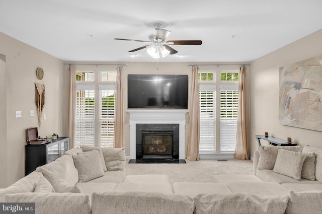 12116 Elmwood Dr, Brandywine, MD 20613 - carpeted living area featuring a ceiling fan, a premium fireplace, and plenty of natural light