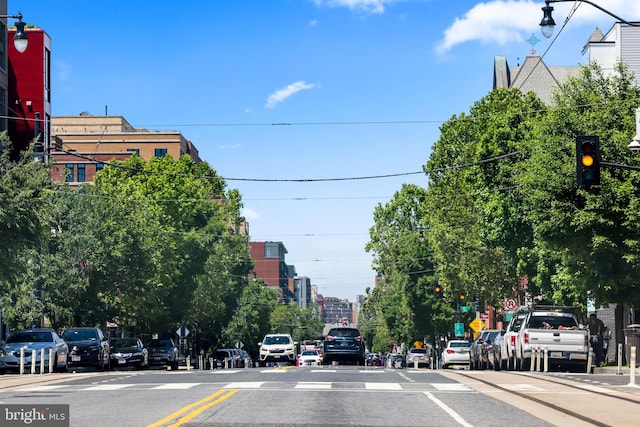 2221 M St NE Unit Ph1, Washington, DC 20002 - view of asphalt street featuring traffic lights, sidewalks, street lights, and curbs