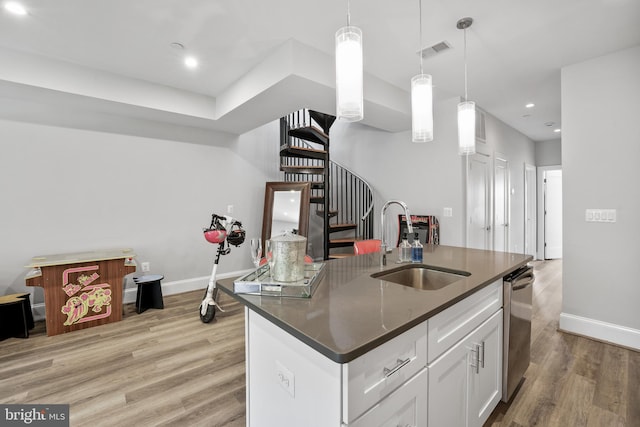 2221 M St NE Unit Ph1, Washington, DC 20002 - kitchen featuring a sink, dark countertops, light wood finished floors, baseboards, and recessed lighting